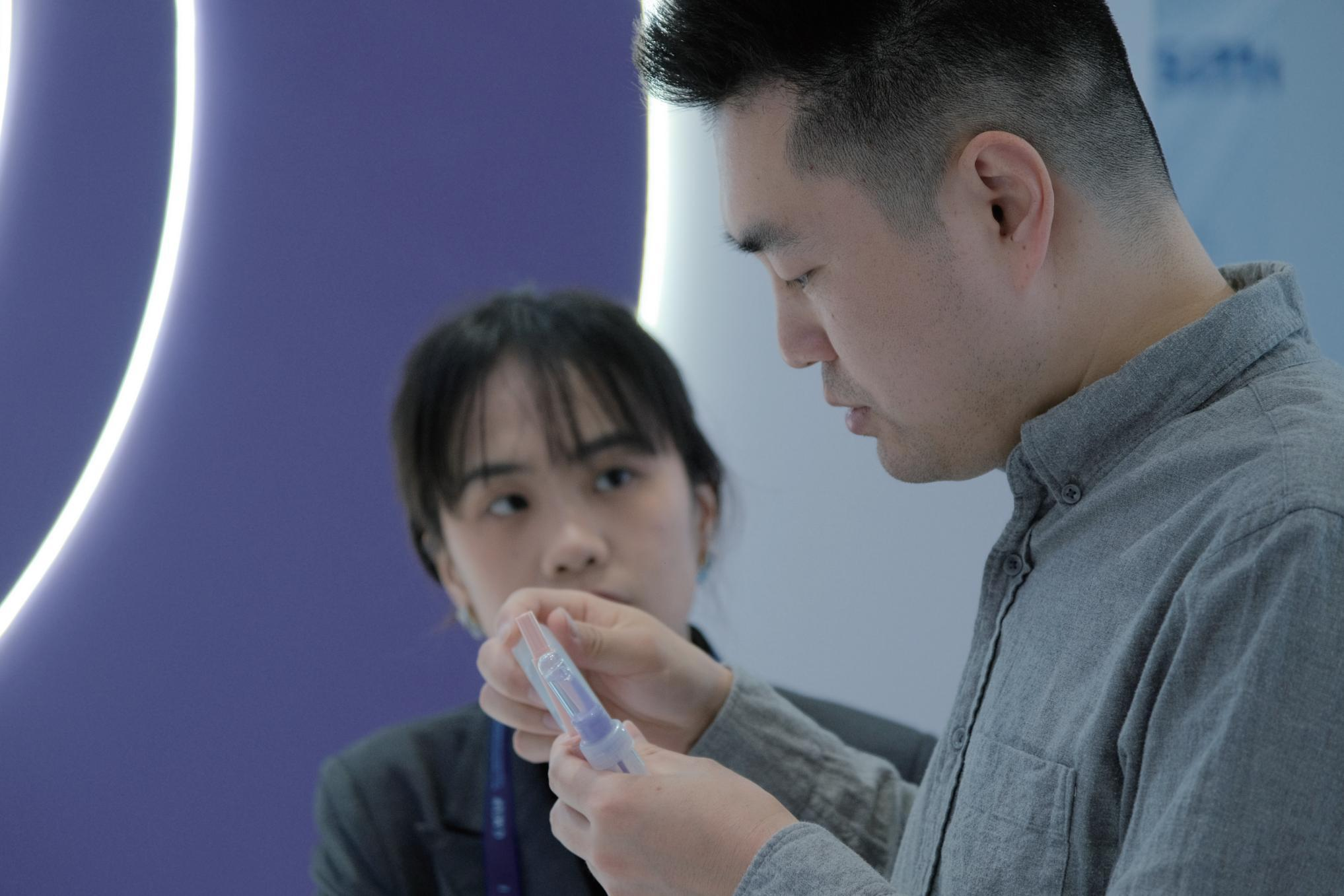 Looking at a tool together during a face-to-face conversation